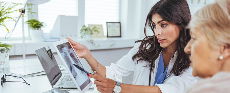 Doctor explaining results of lung check up from x-ray scan chest 
